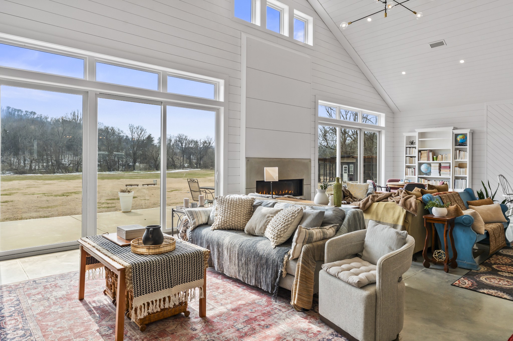 105 Mc Kinney Road Gordonsville, TN 38563 - Photo 11 of 91 a living room with furniture and a floor to ceiling window
