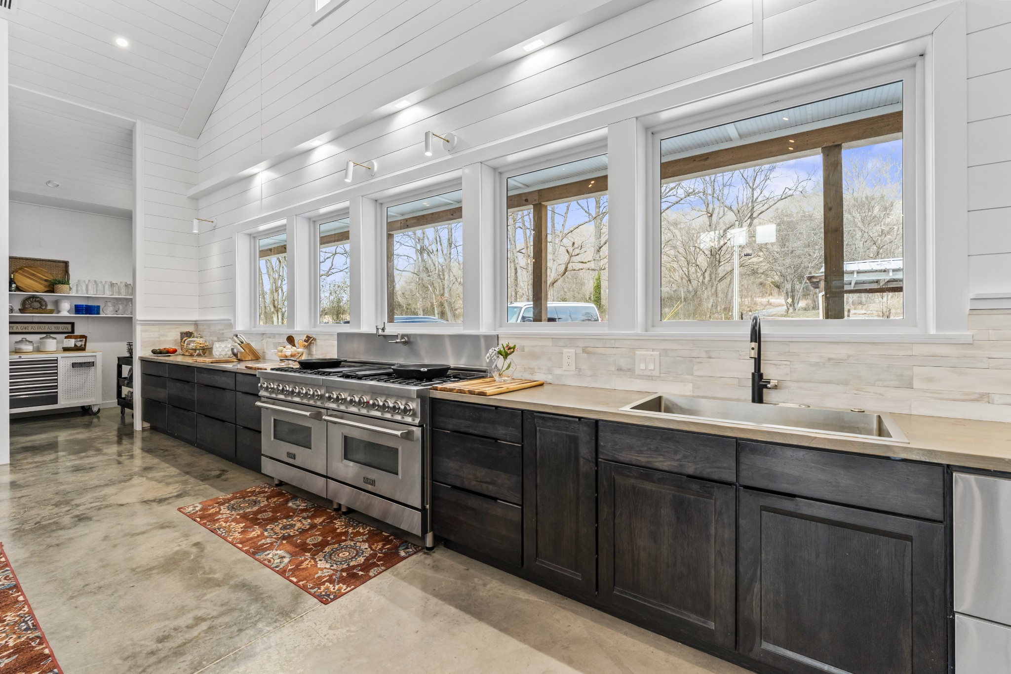 105 Mc Kinney Road Gordonsville, TN 38563 - Photo 22 of 91 a kitchen with a sink stove and cabinets