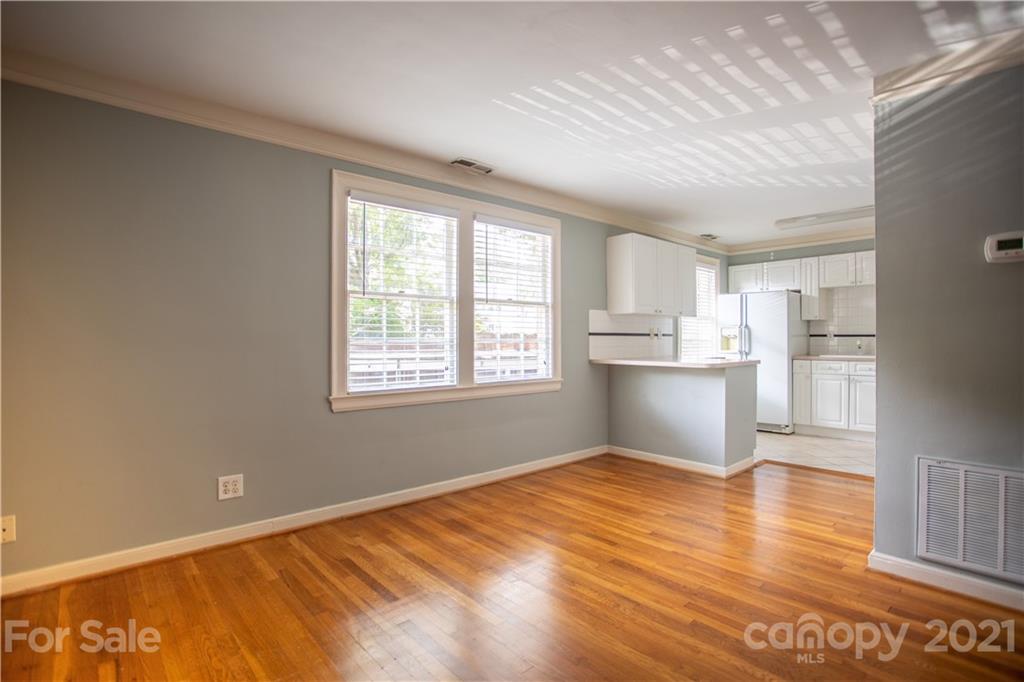 104 Colville Road, Unit 42A Charlotte, NC 28207 - Photo 8 of 19 a view of a kitchen with wooden floor and a kitchen