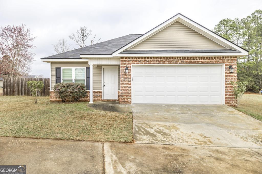 103 Denali Drive Perry, GA 31069 - Photo 1 of 1 a front view of a house with garden