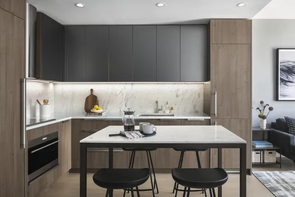 a kitchen with a dining table and chairs