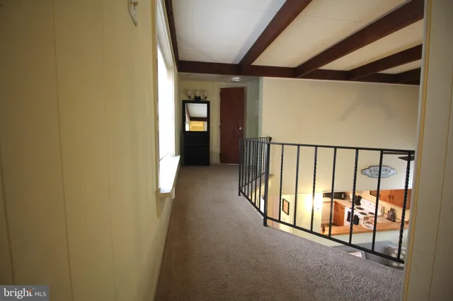 a view of hallway with stairs