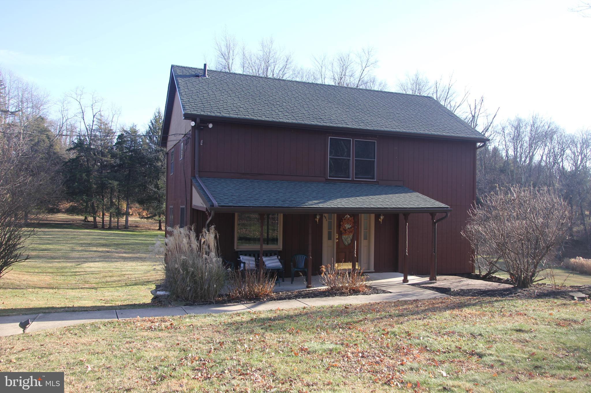 48 Poor Farm Road, Unit COTTAGE Pennington, NJ 08534 - Photo 2 of 34 a view of a house with backyard porch and sitting area