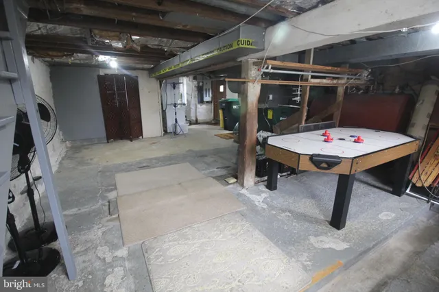 a room with table chairs and a window