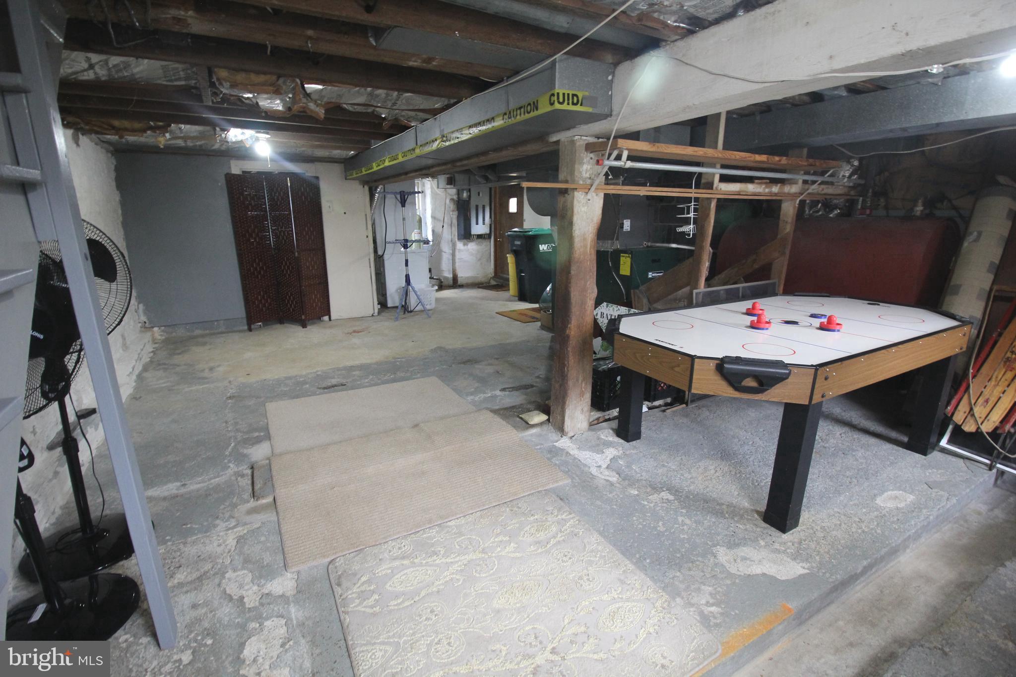48 Poor Farm Road, Unit COTTAGE Pennington, NJ 08534 - Photo 27 of 34 a room with stainless steel appliances kitchen island a table and chairs in it