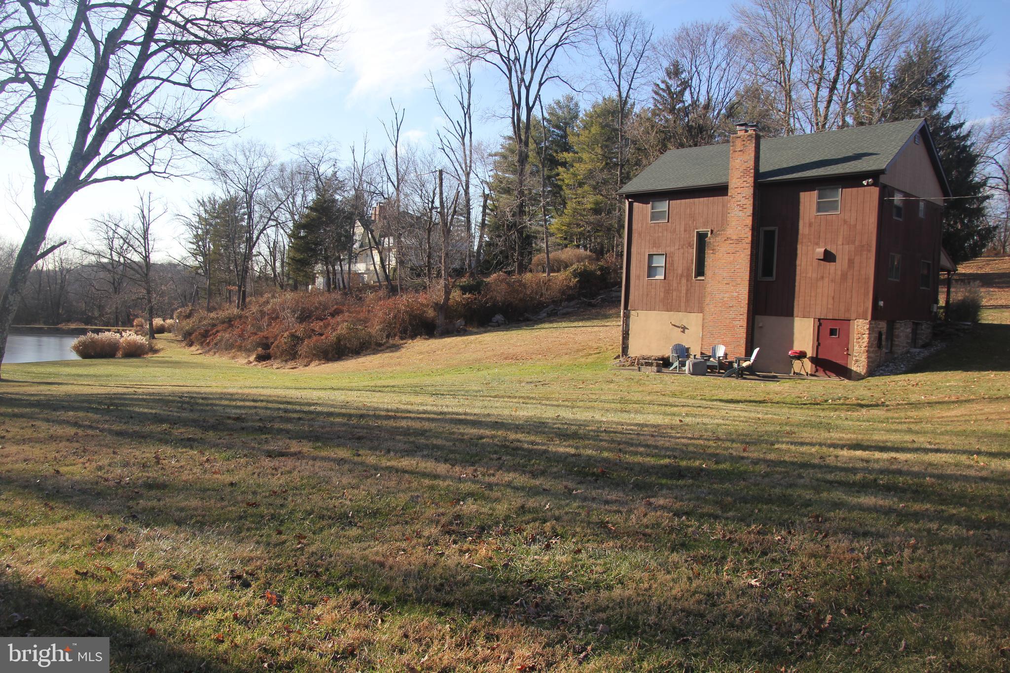 48 Poor Farm Road, Unit COTTAGE Pennington, NJ 08534 - Photo 31 of 34 a view of a house with a yard
