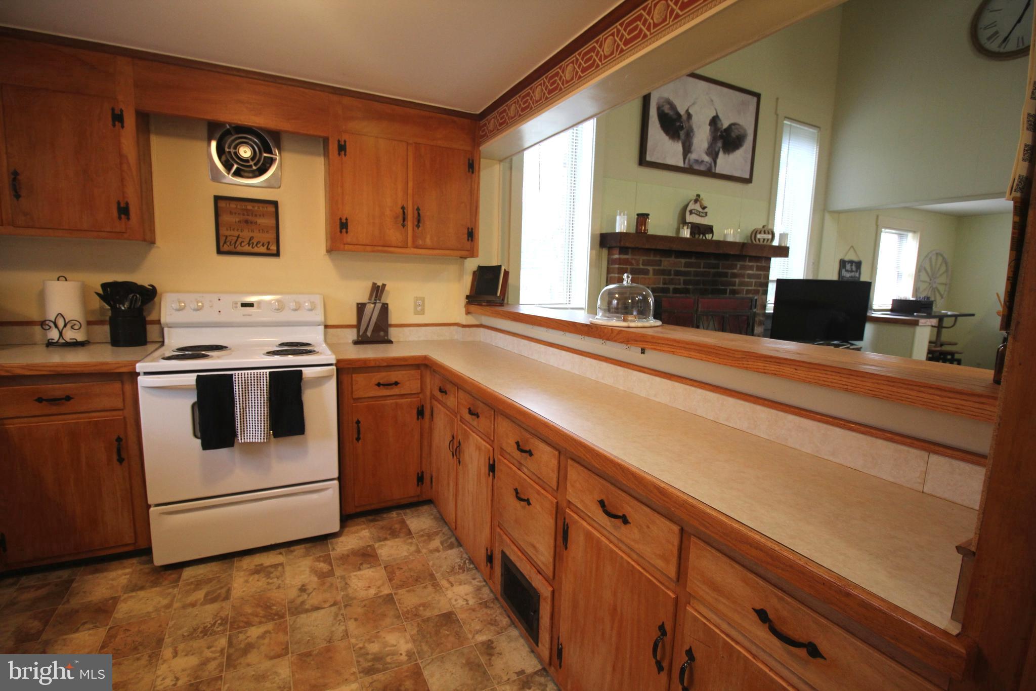 48 Poor Farm Road, Unit COTTAGE Pennington, NJ 08534 - Photo 10 of 34 a kitchen with stainless steel appliances granite countertop a stove and a sink