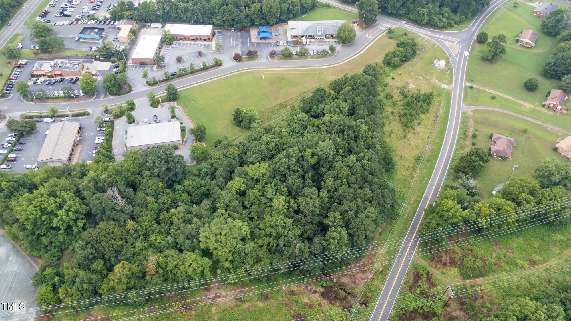 1600 Orange Grove Road Hillsborough, NC 27278 - Photo 10 of 14 a aerial view of a house with a yard and lake view