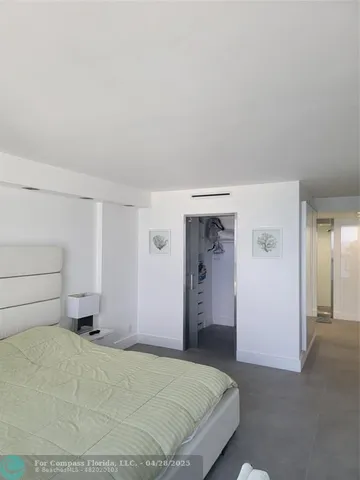 a bedroom with a bed and utility room