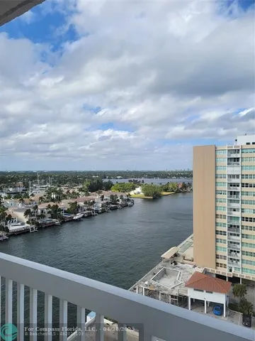 a view of a lake and tall building