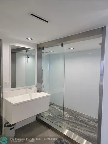 a bathroom with a bathtub and a sink