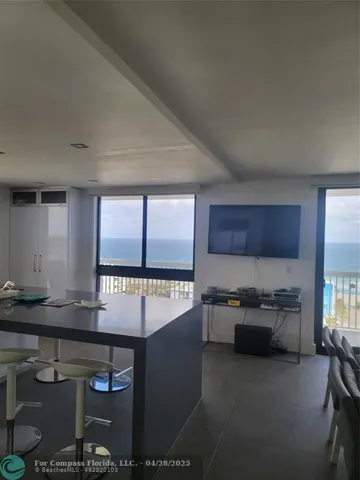 a kitchen with a sink and a stove top oven