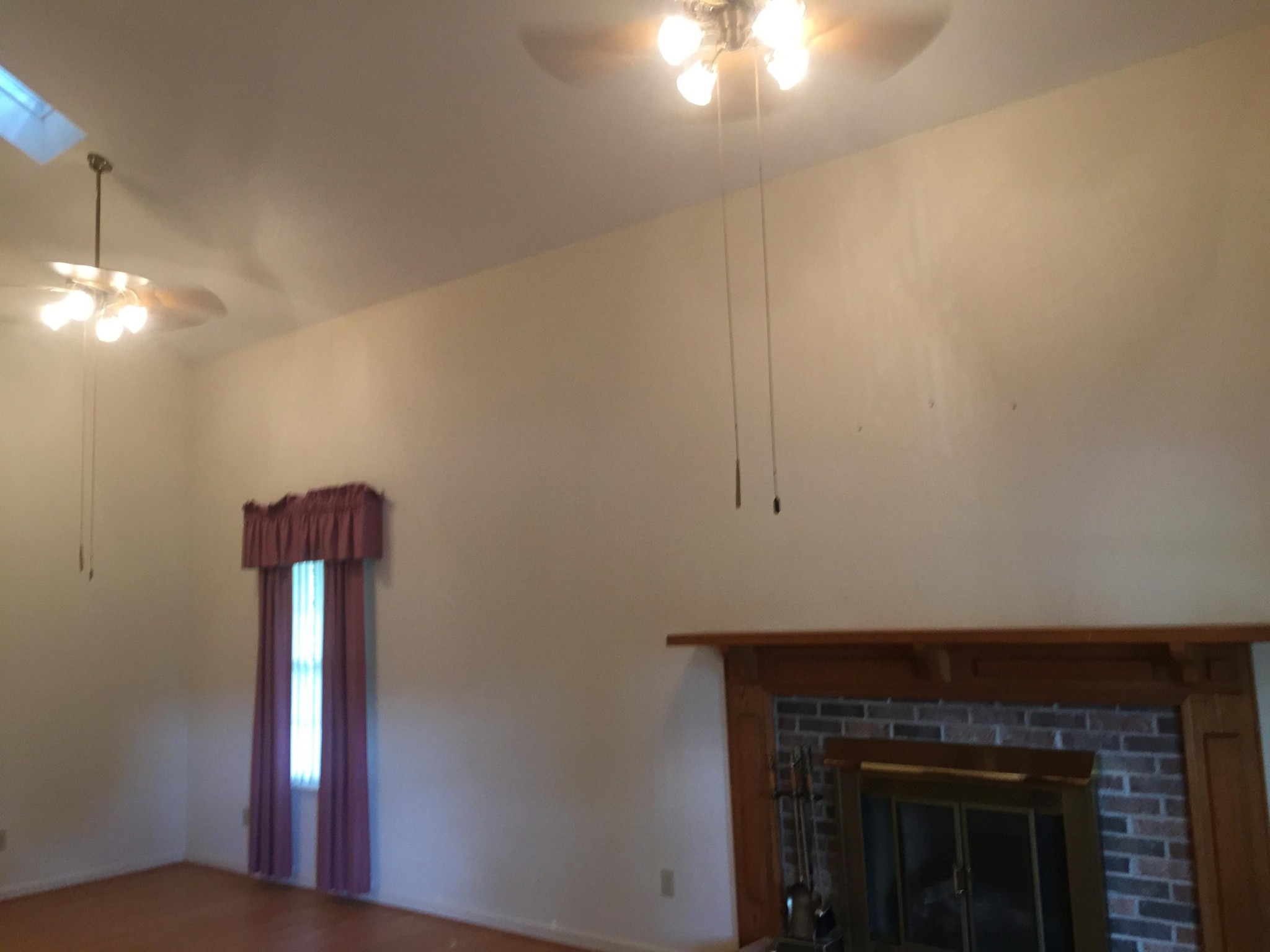 1144 North Rachaels Circle Maryville, TN 37804 - Photo 2 of 18 a kitchen with a hallway and a fireplace