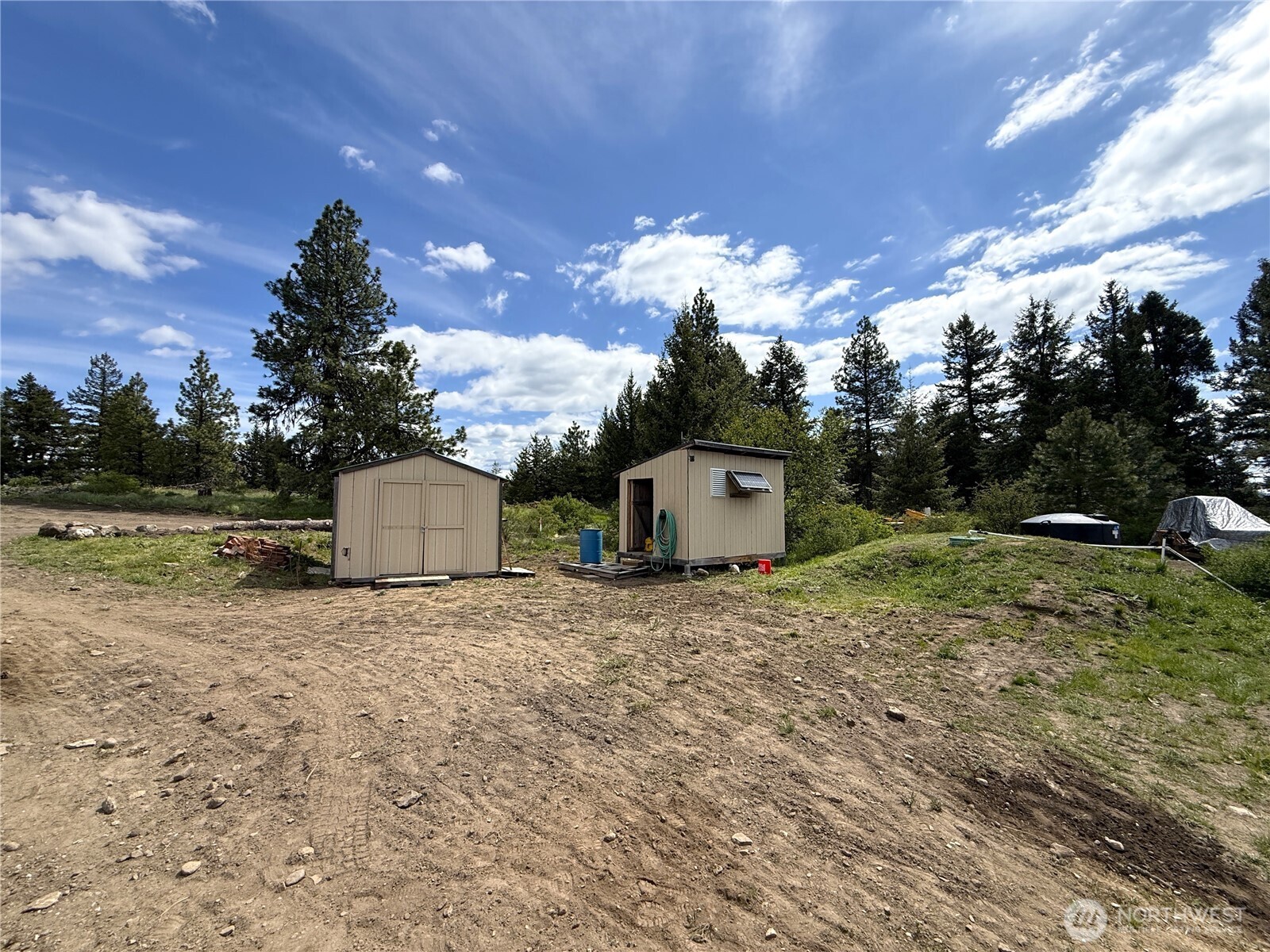 19 Union Ridge Spur Road Republic, WA 99166 - Photo 21 of 33 a view of a house with a backyard and a tree