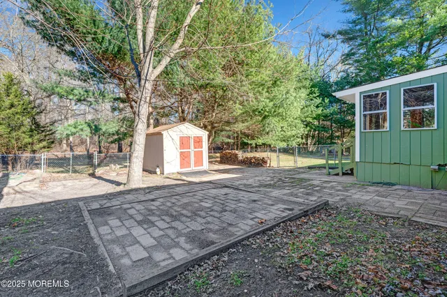 a view of house with backyard