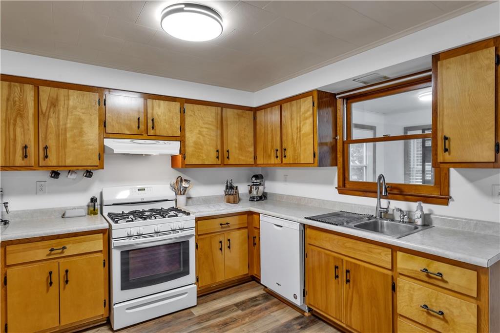 156 Manor Road Delmont, PA 15626 - Photo 12 of 32 17x11 Kitchen. Double Stainless Sink, Dishwasher and Gas Stove with Range Hood.