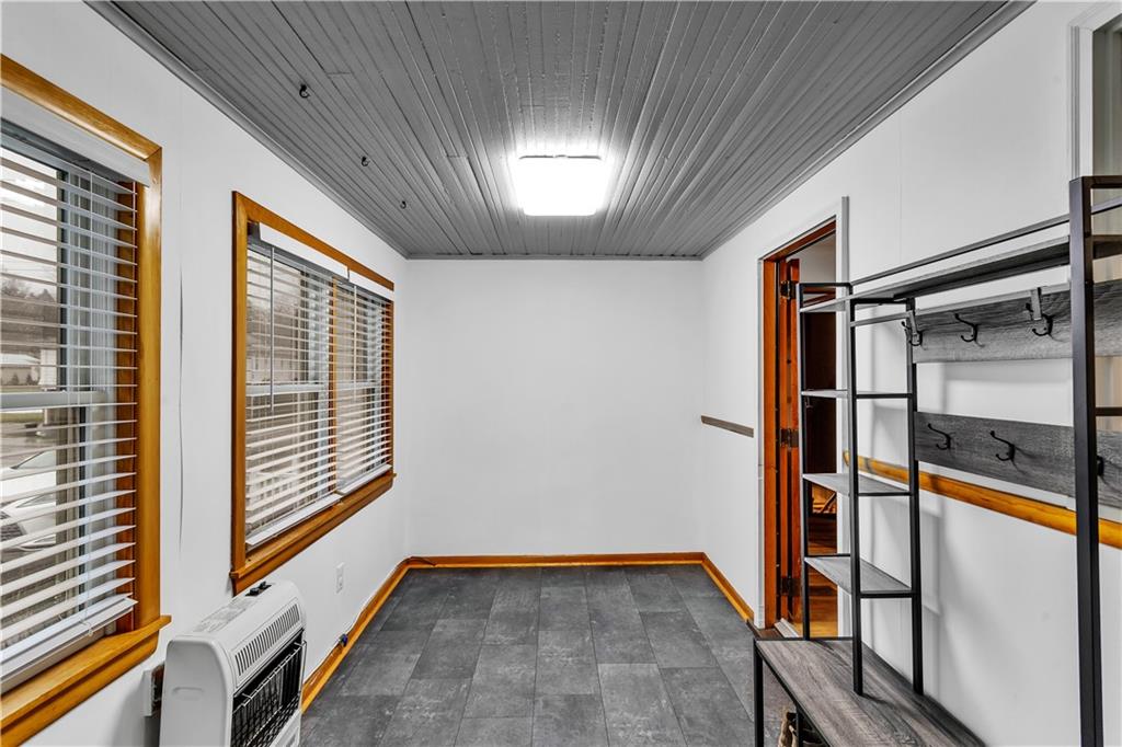 156 Manor Road Delmont, PA 15626 - Photo 14 of 32 Sunroom/Mudroom. 15x8 with wall heater. Opens to Kitchen and Driveway.