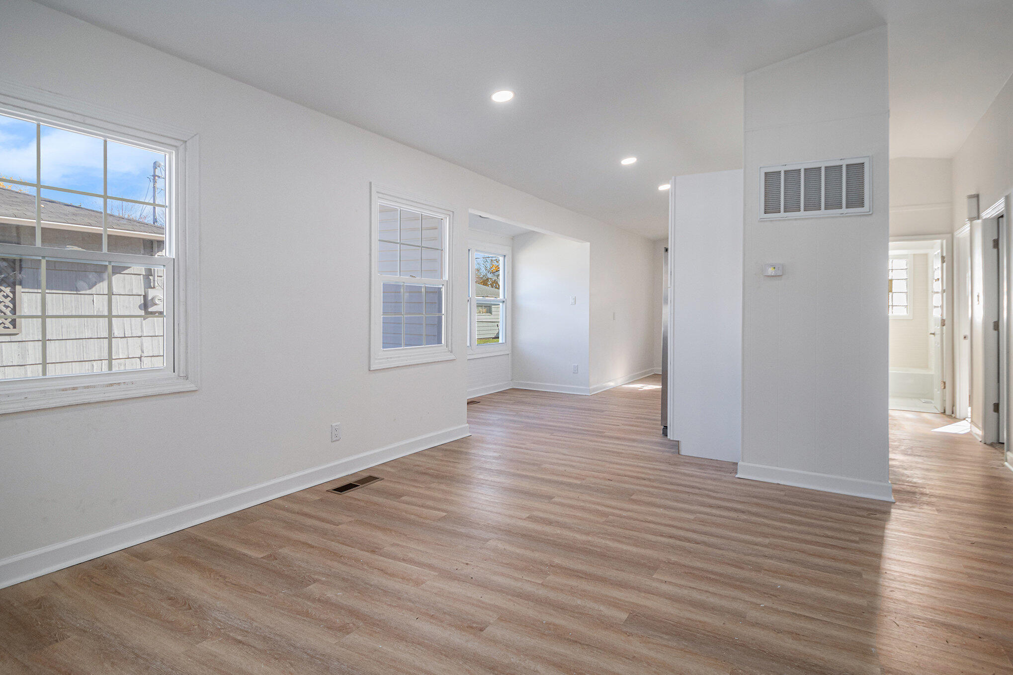 3336 175th Street Hammond, IN 46323 - Photo 2 of 14 a view of an empty room with wooden floor and a window
