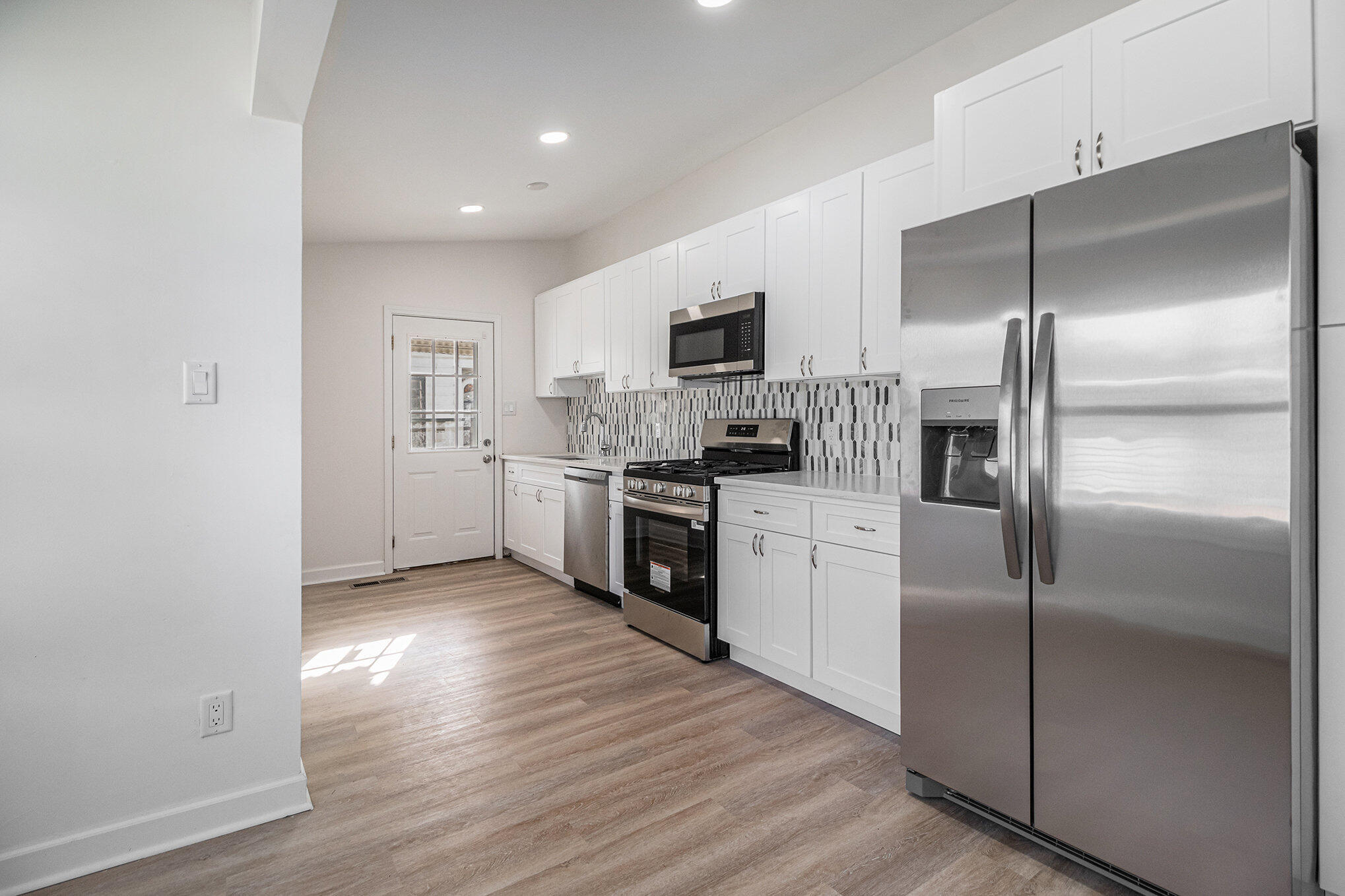 3336 175th Street Hammond, IN 46323 - Photo 3 of 14 a kitchen with a refrigerator and a oven