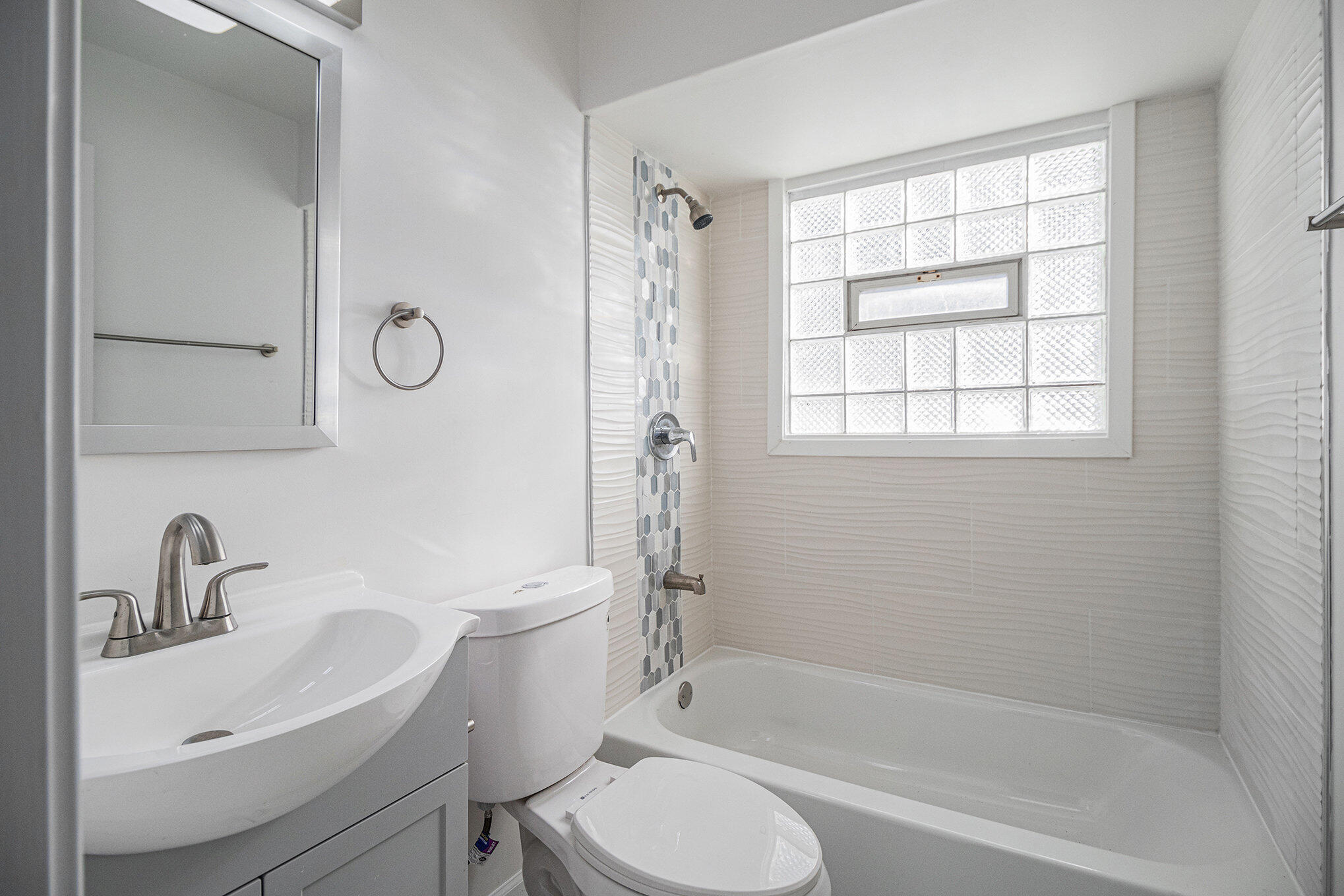 3336 175th Street Hammond, IN 46323 - Photo 8 of 14 a bathroom with a sink toilet and shower