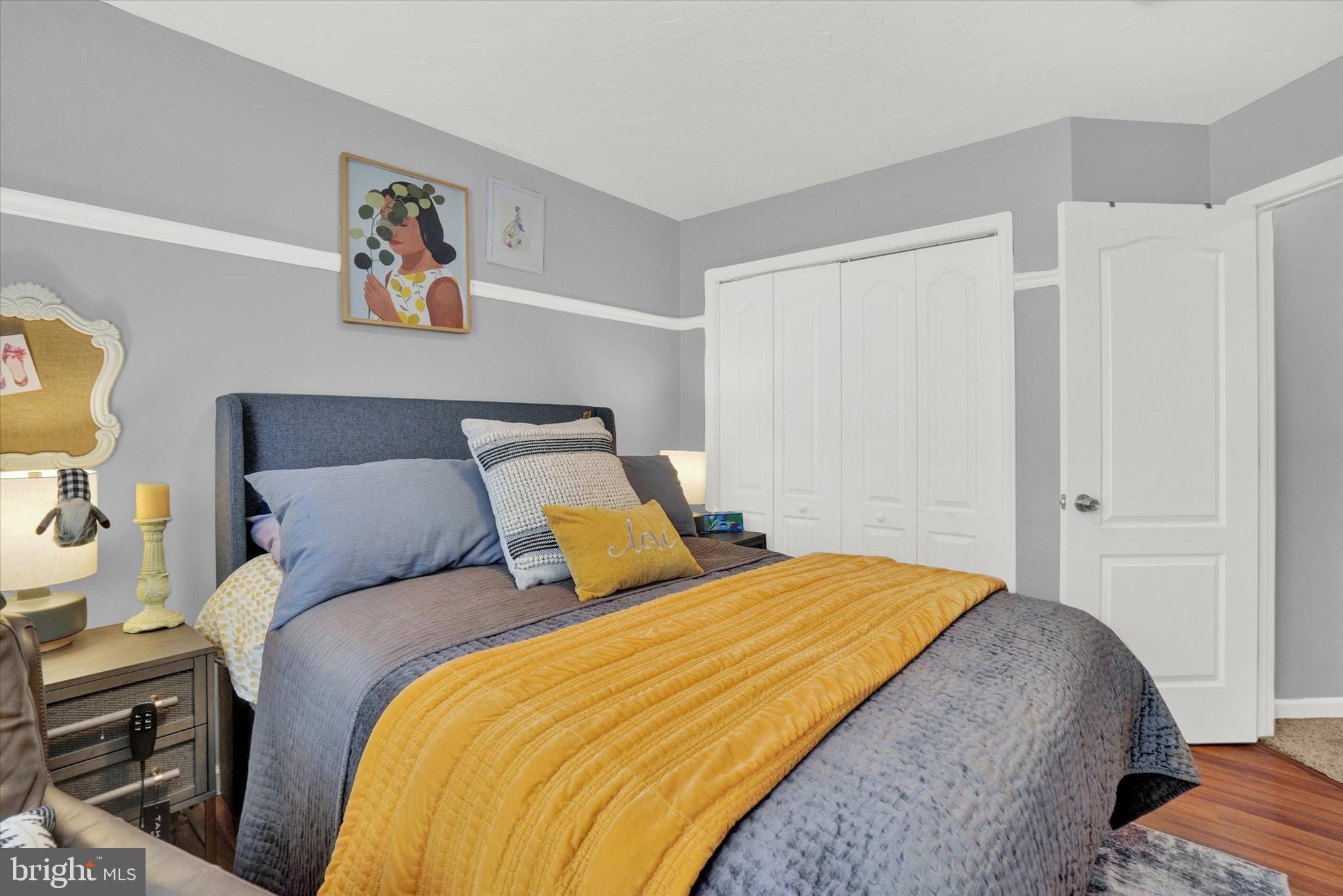 2411 Schultz Way, Unit 37 York, PA 17402 - Photo 16 of 32 a bed room with a bed and painting on the wall