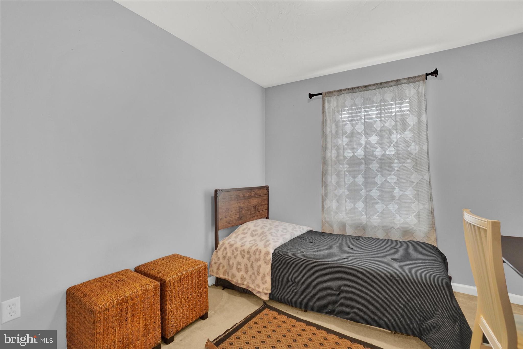 2411 Schultz Way, Unit 37 York, PA 17402 - Photo 17 of 32 a bedroom with a bed and wooden floor