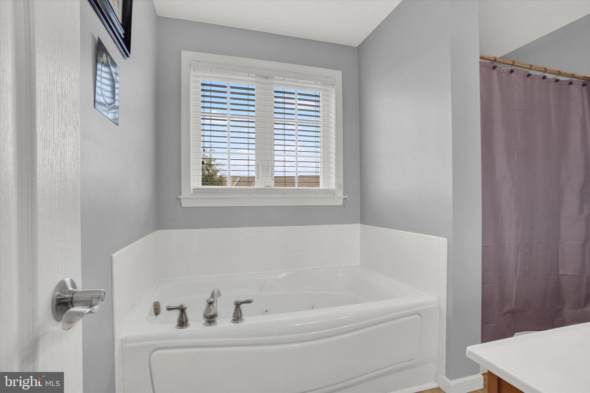 2411 Schultz Way, Unit 37 York, PA 17402 - Photo 21 of 32 a white bath tub sitting next to a window