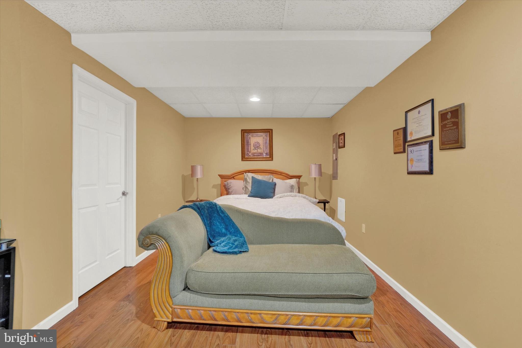 2411 Schultz Way, Unit 37 York, PA 17402 - Photo 24 of 32 a bedroom with a bed and wooden floor