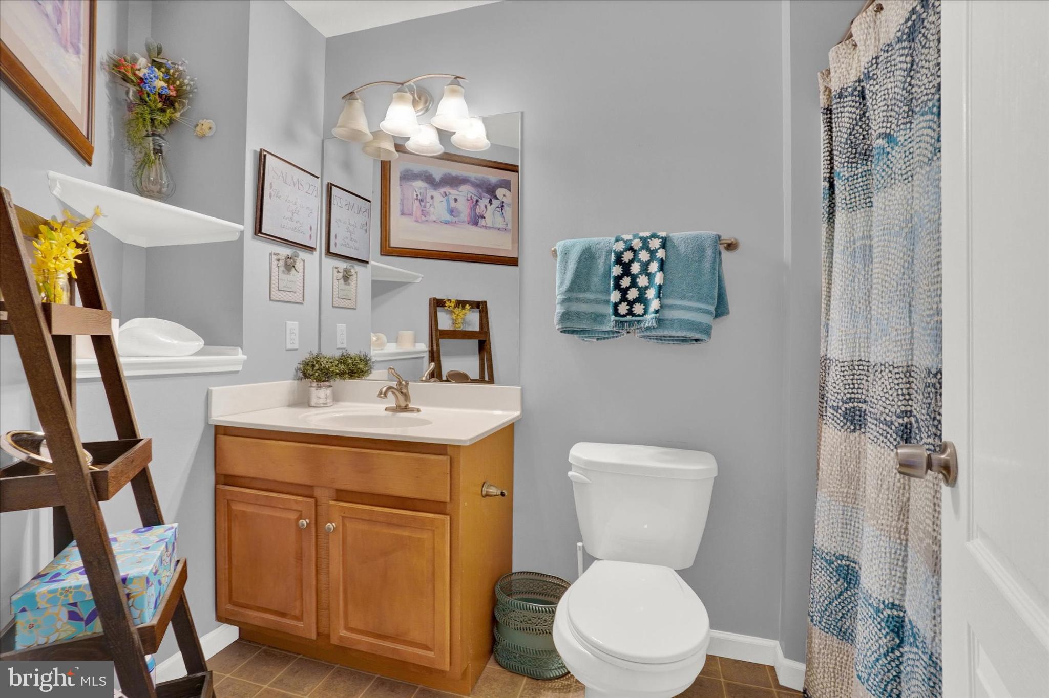 2411 Schultz Way, Unit 37 York, PA 17402 - Photo 26 of 32 a bathroom with a toilet a sink and a mirror