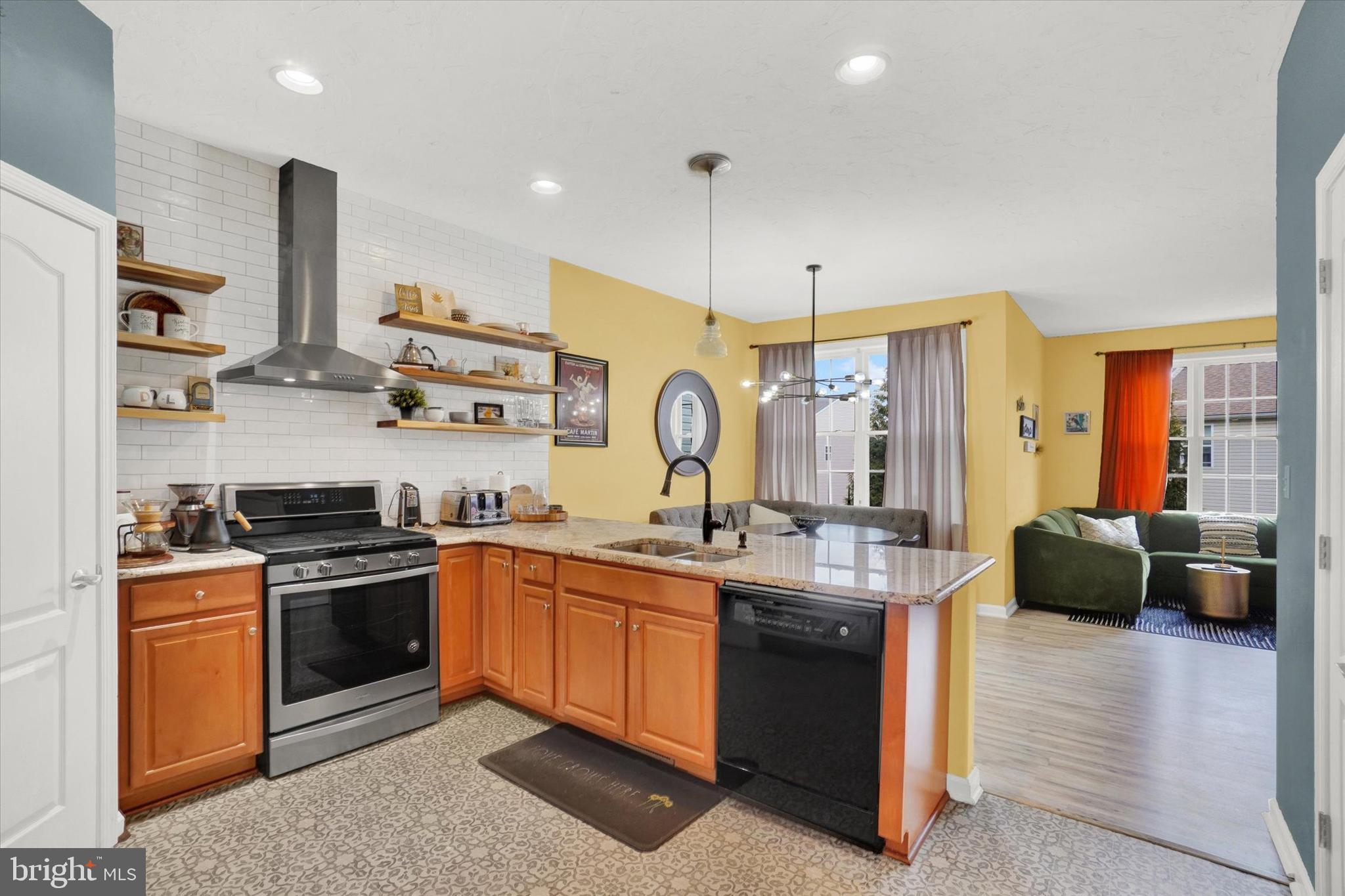 2411 Schultz Way, Unit 37 York, PA 17402 - Photo 6 of 32 a kitchen with stainless steel appliances granite countertop a sink a stove and a refrigerator