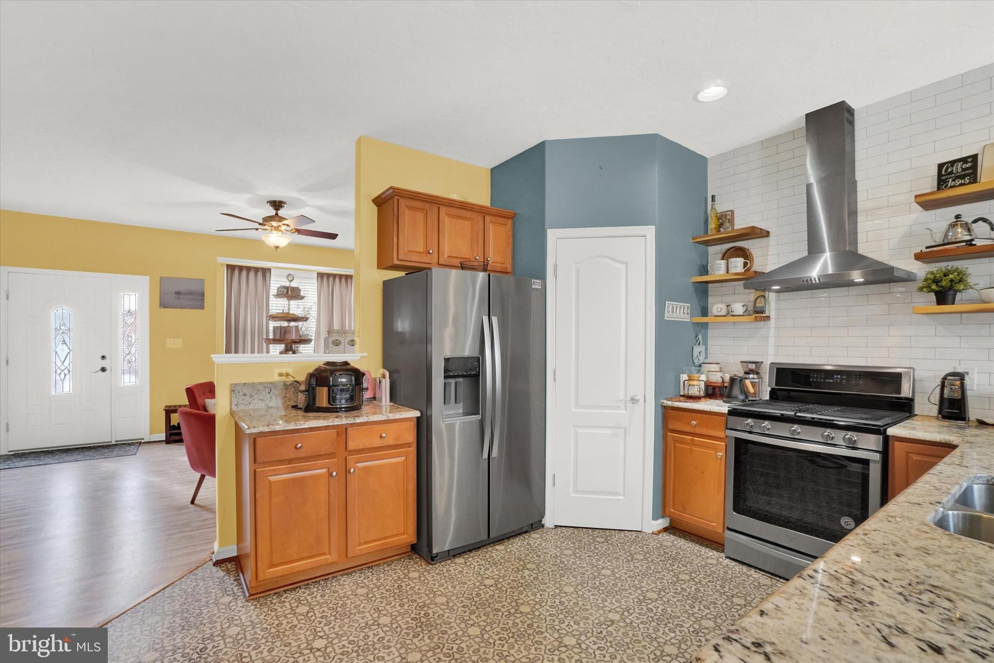 2411 Schultz Way, Unit 37 York, PA 17402 - Photo 7 of 32 a kitchen with stainless steel appliances granite countertop a refrigerator stove and sink