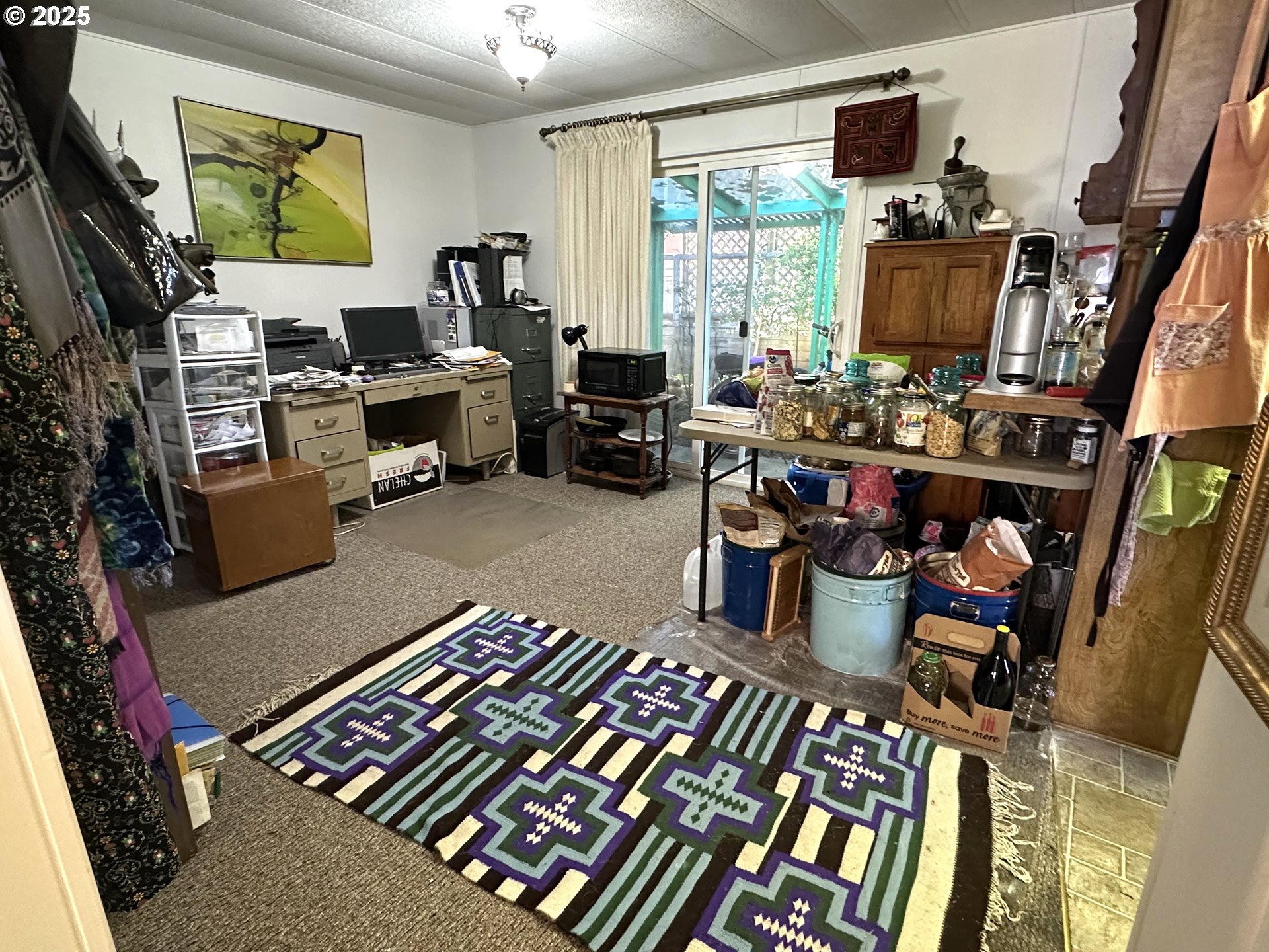1601 Rhododendron Drive, Unit 572 Florence, OR 97439 - Photo 11 of 31 a room with lots of furniture and gym equipment