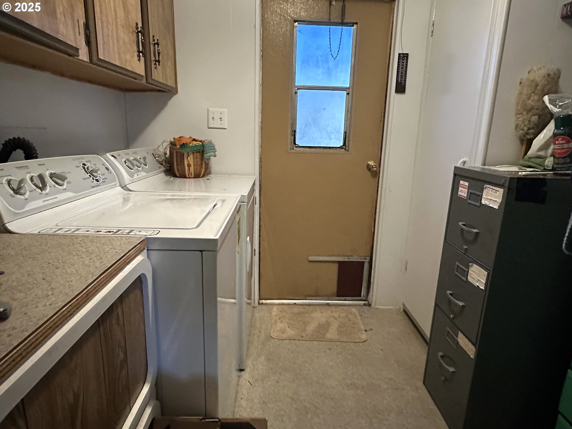 1601 Rhododendron Drive, Unit 572 Florence, OR 97439 - Photo 12 of 31 a utility room with dryer and washer