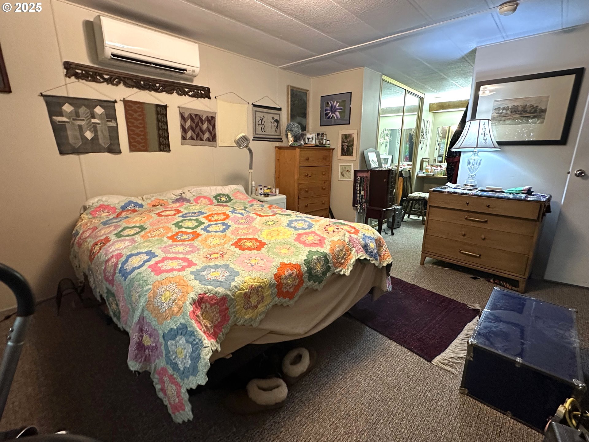 1601 Rhododendron Drive, Unit 572 Florence, OR 97439 - Photo 14 of 31 a bedroom with a bed and wooden floor