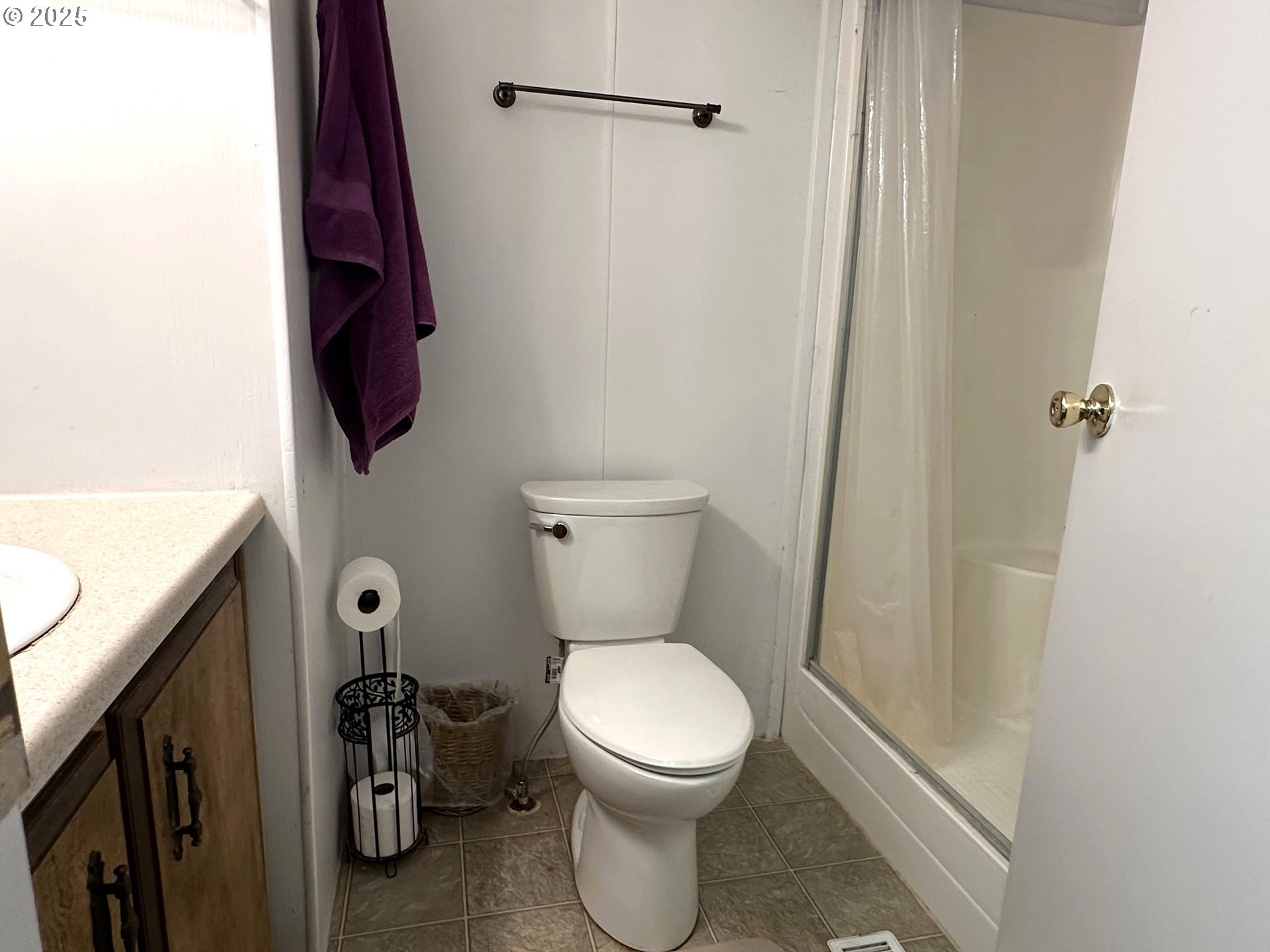 1601 Rhododendron Drive, Unit 572 Florence, OR 97439 - Photo 15 of 31 a bathroom with a toilet and a shower