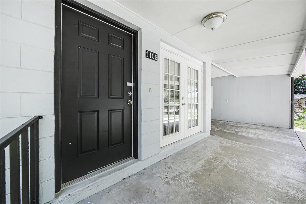 1109 Inland Street Leesburg, FL 34748 - Photo 2 of 15 a view of empty room with windows