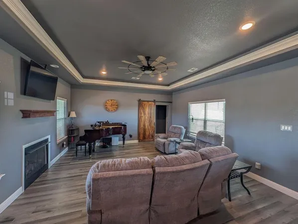 a bedroom with furniture and wooden floor