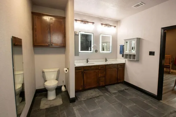 a bathroom with a sink a mirror and shower