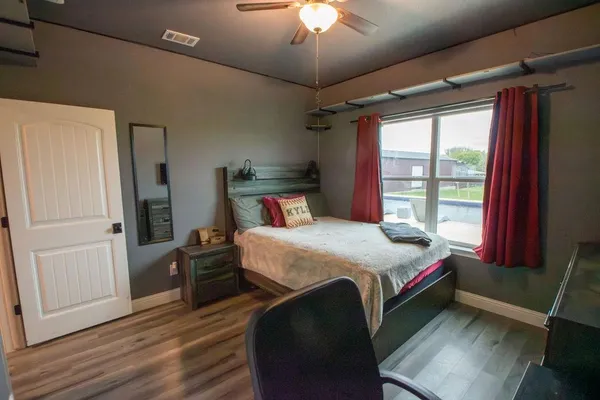 a living room with furniture and lamp