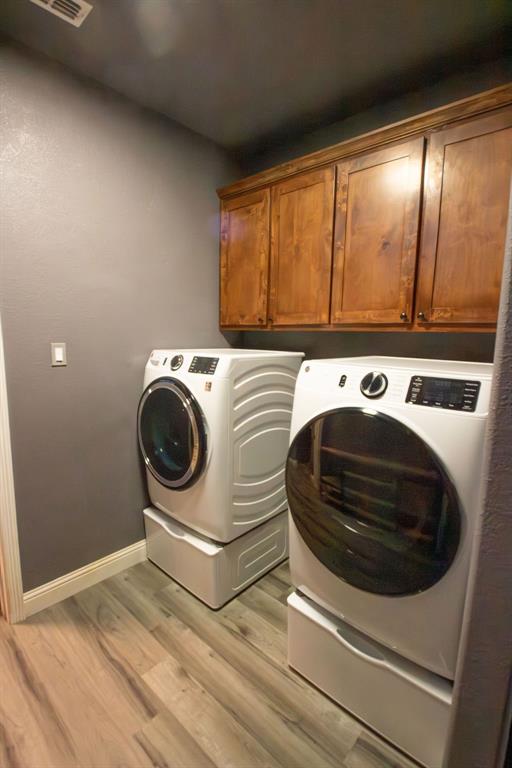 1144 Alamo Road Montague, TX 76251 - Photo 26 of 26 a utility room with dryer and washer