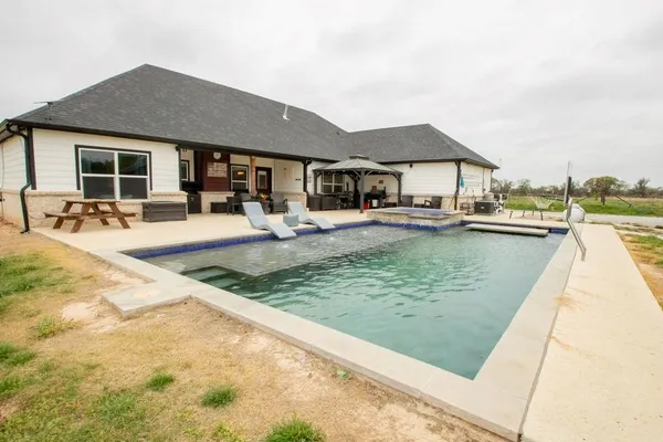 a view of a house with swimming pool