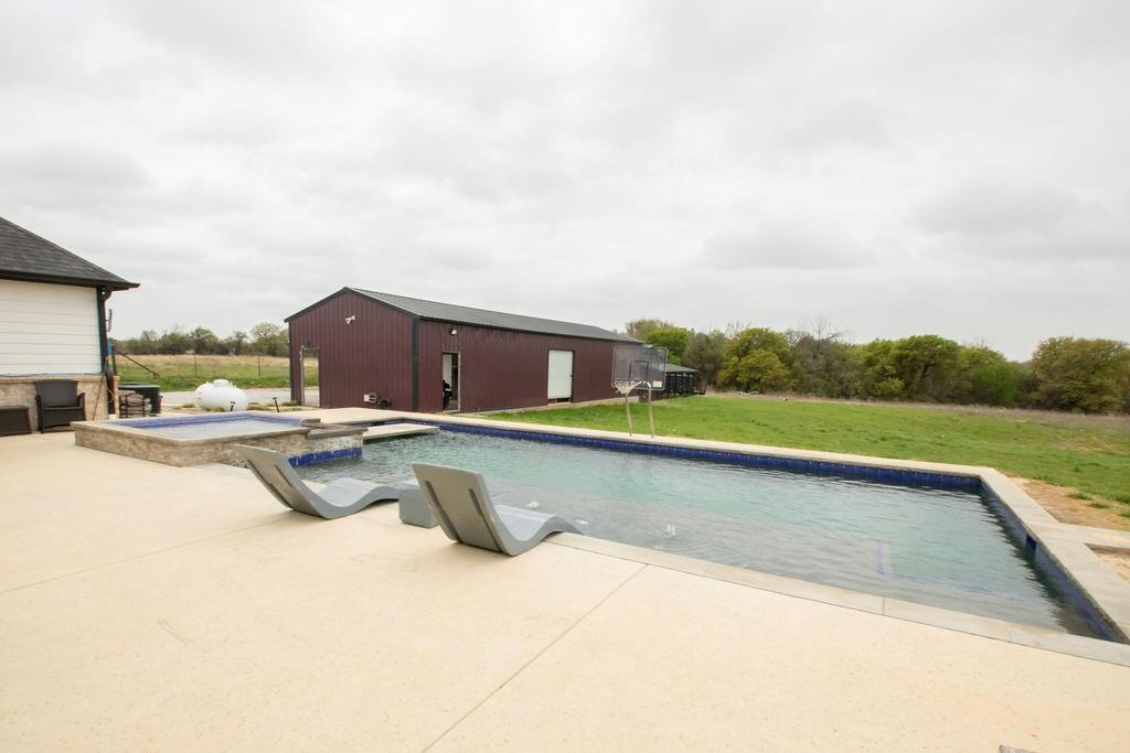 1144 Alamo Road Montague, TX 76251 - Photo 4 of 26 a view of swimming pool with a yard