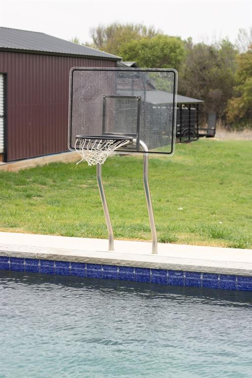1144 Alamo Road Montague, TX 76251 - Photo 7 of 26 a view of a backyard with lawn chairs and plants