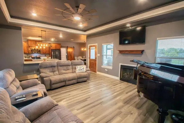 a large kitchen with a table and chairs