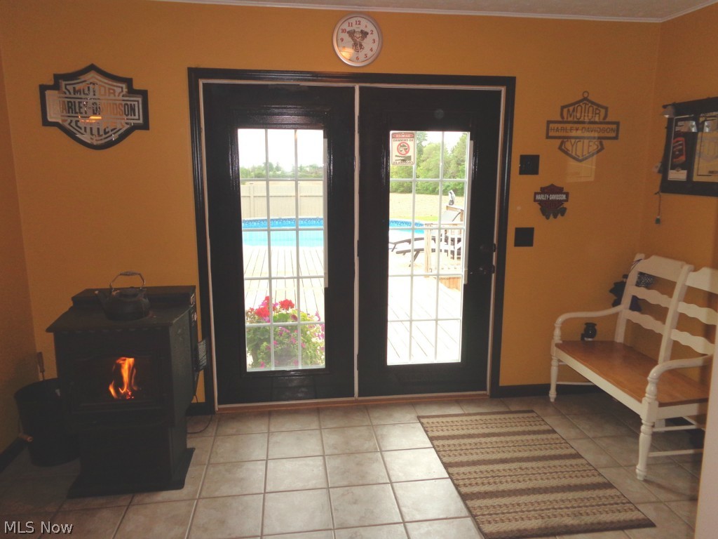 2725 Boos Road Huron, OH 44839 - Photo 5 of 17 Family room/area with corner burner & patio door to the back yard deck & above ground pool.