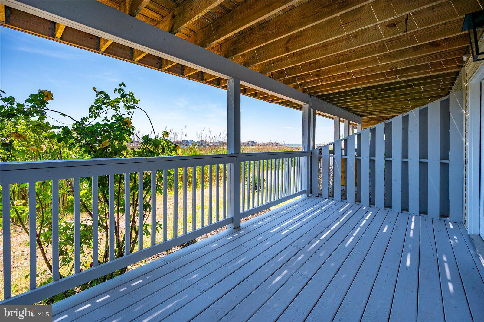 135 Jamestown Road, Unit 18A Ocean City, MD 21842 - Photo 38 of 63 a view of porch with wooden floor