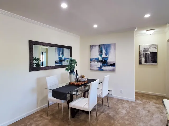 a dining room with furniture and window