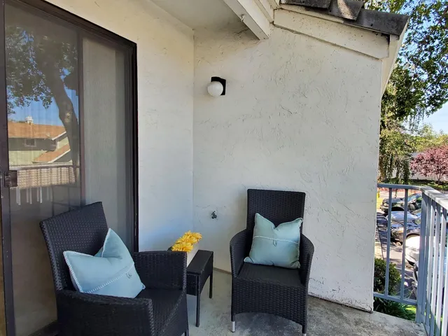 a view of a livingroom with furniture and wooden floor