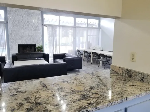 a living room with furniture window and a fireplace