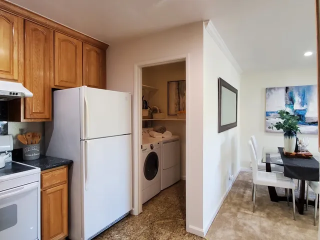 a white refrigerator freezer sitting in a kitchen